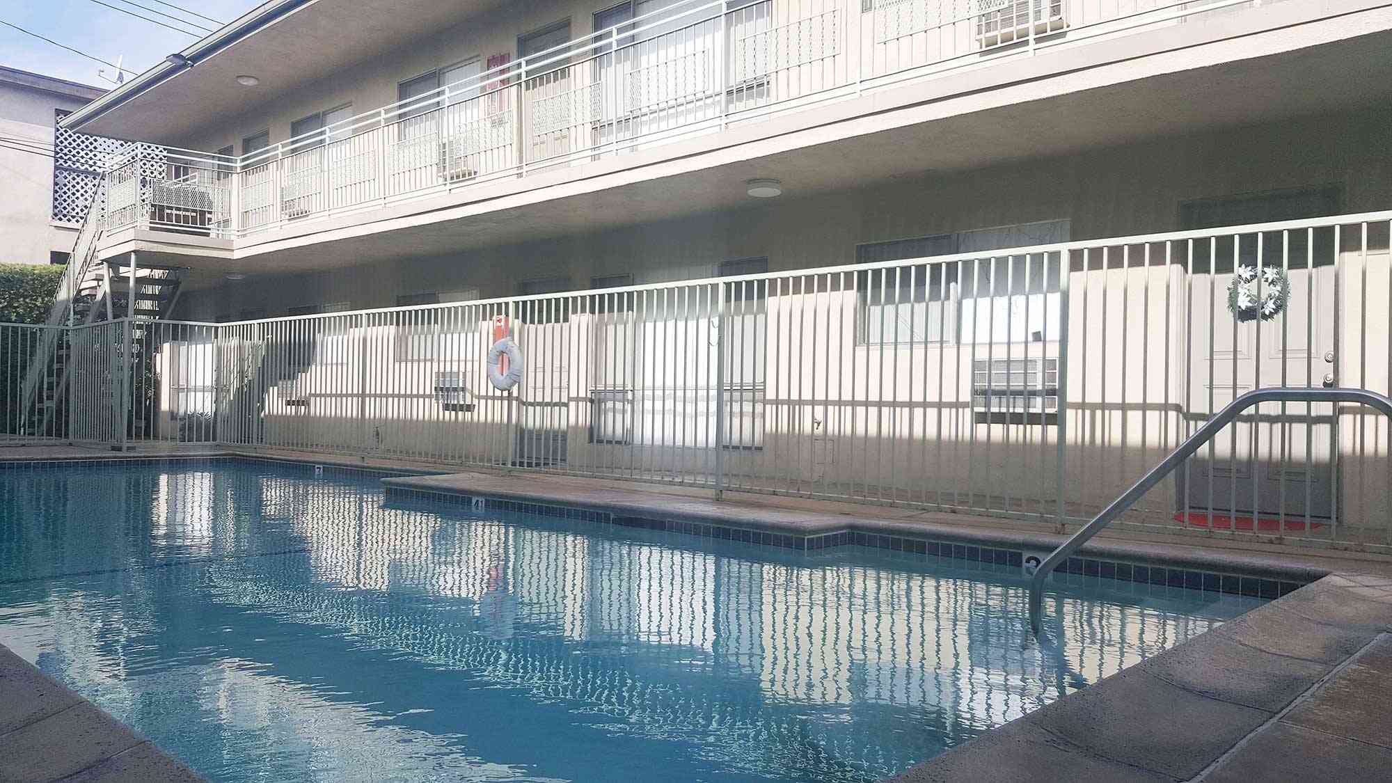gated swimming pool and resident walkways
