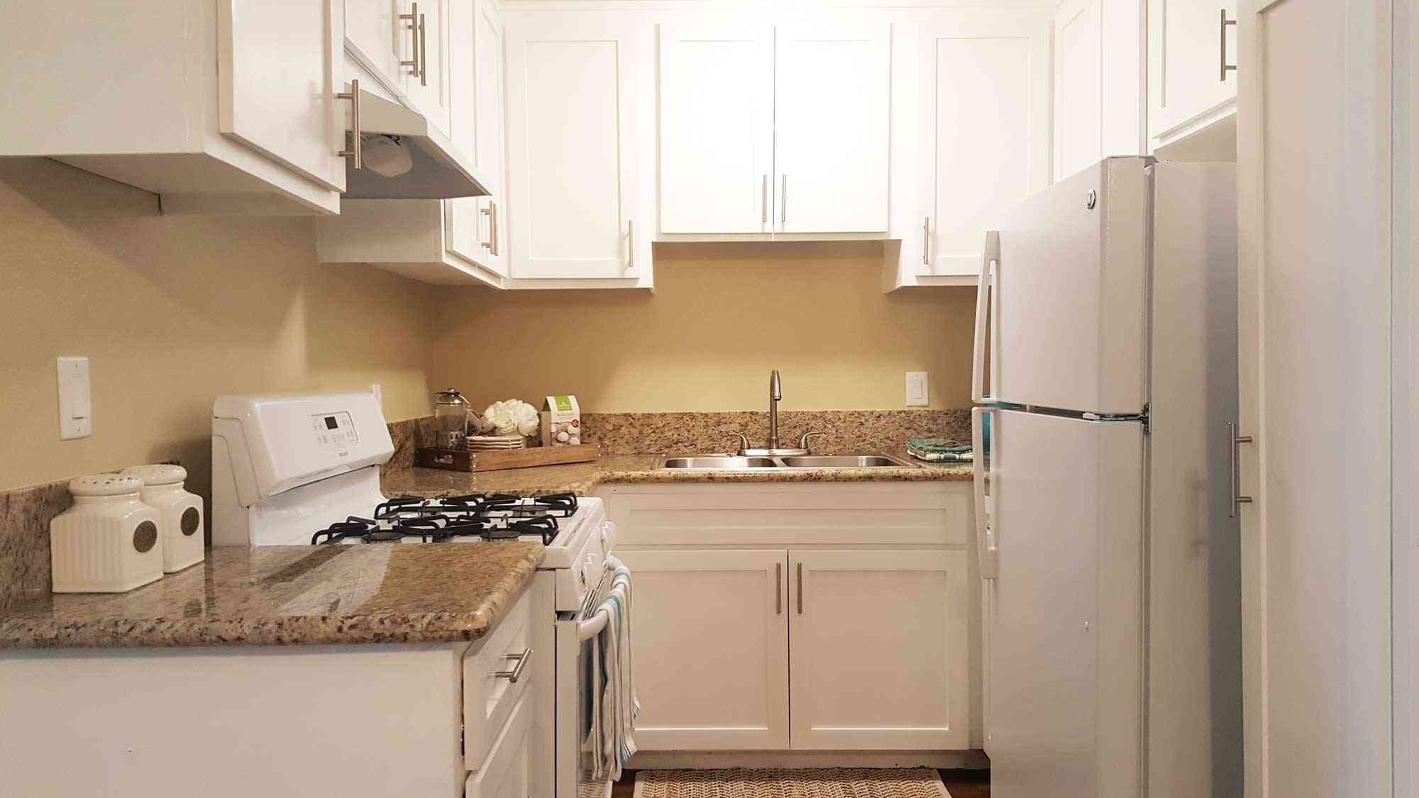 updated kitchen with white appliances and ample storage