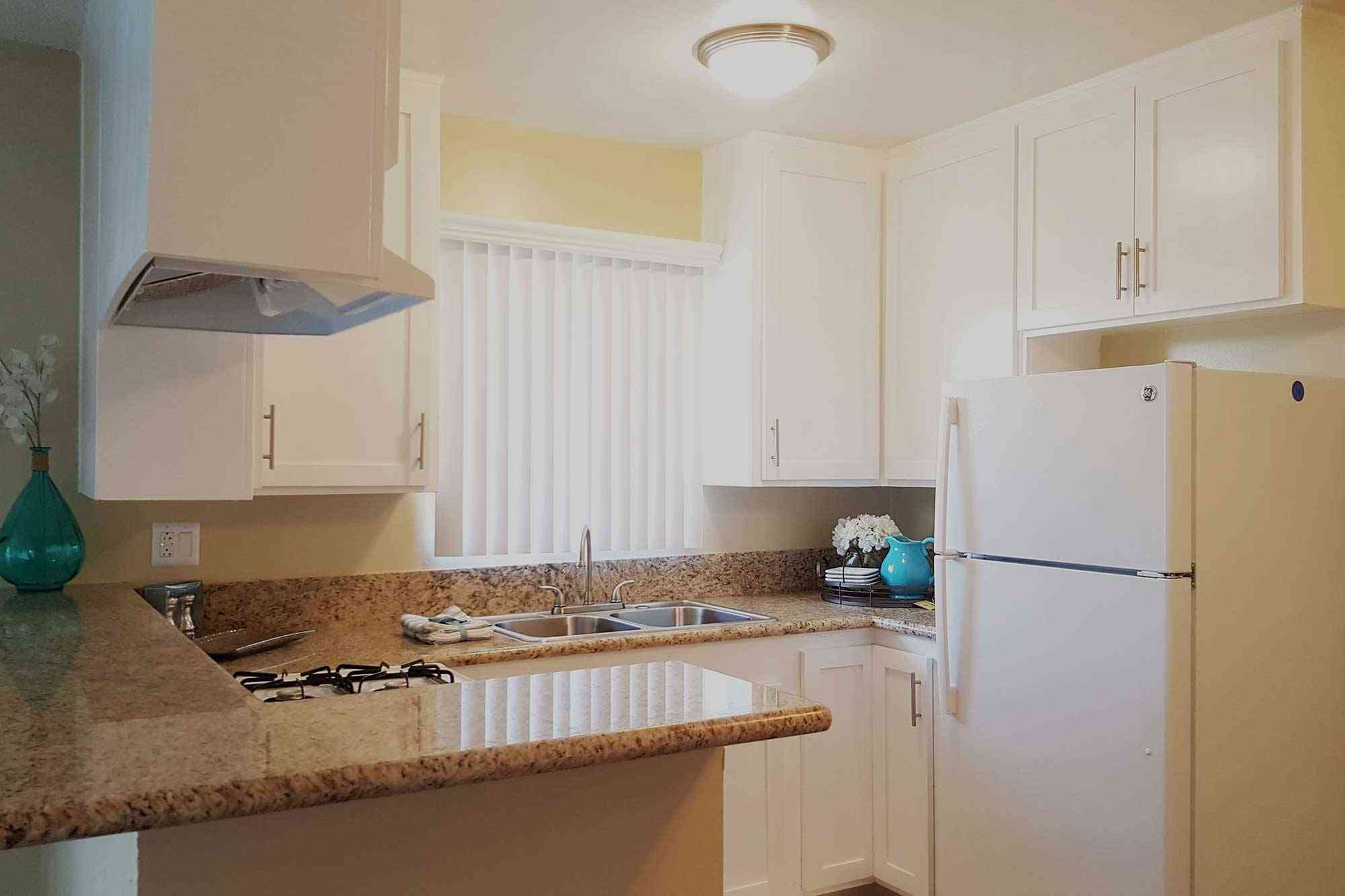 modern kitchen with granite style counters