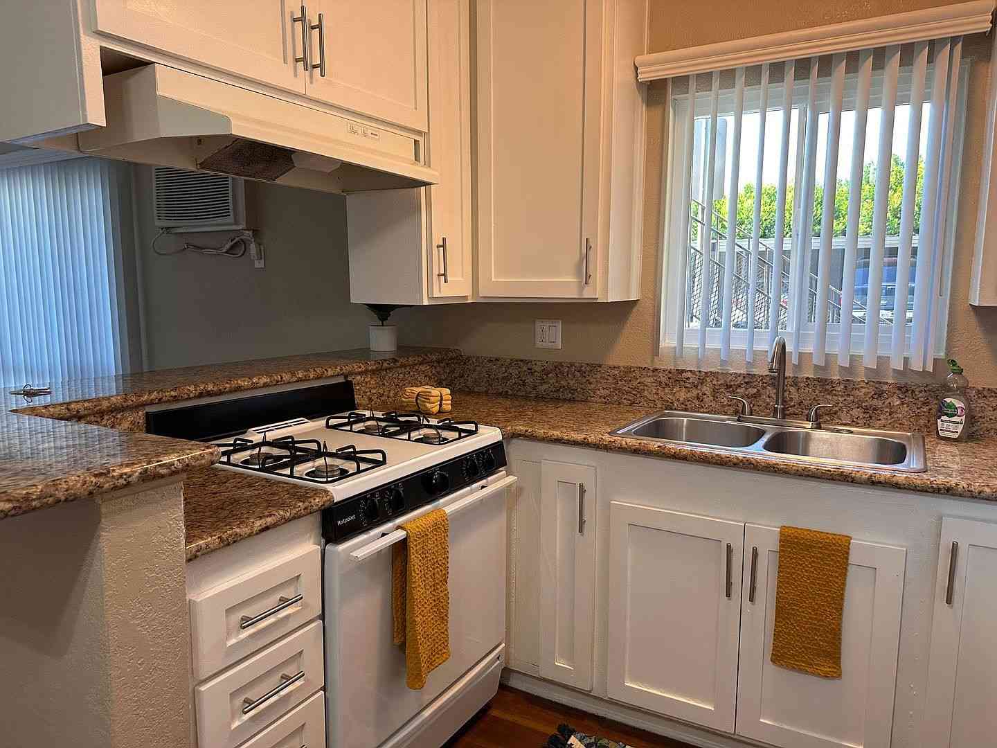 renovated kitchen with white cabinetry